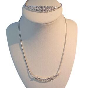 Beautiful silver-tone necklace and bracelet set. Both adjustable, and brand new.